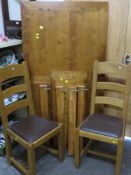 A modern extending dining table and chairs