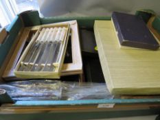 A quantity of cased cutlery sets etc together with a tray of placemats