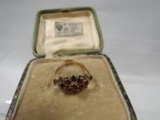 A hallmarked 9 carat gold garnet ring approx. weight 1.8g