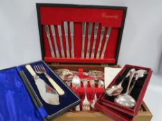 A vintage canteen of cutlery and two boxes of cutlery