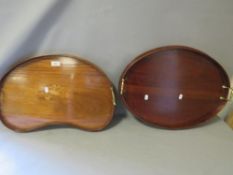 An in-laid twin handled kidney shaped serving tray together with another (2)