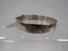 A hallmarked silver engraved bangle approx. weight 37.5g