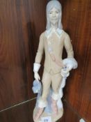 A tall ceramic Spanish figure of a musketeer
