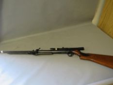 A vintage BSA top loader air riffle with later BSA 4 X 20 edition scope