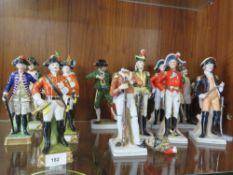 Eleven military figures together with a matador and another some A/F