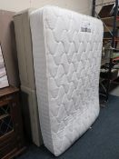 A double divan bed with rest assured mattress