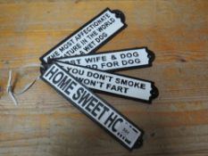 Four rectangular cast signs**