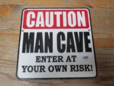 Caution Man Cave sign**
