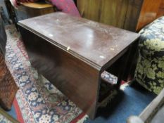An antique mahogany dropleaf table