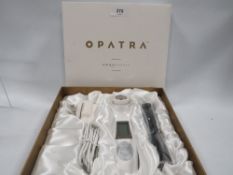 A boxed Opatra dermisonic anti-ageing set, unused, RRP: £250