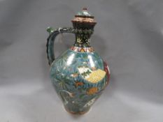 A Hungarian Fischer Budapest polychrome puzzle type jug with filling point to handle and several