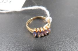 A hallmarked 9 carat gold tanzanite type ring approx. weight 2.6g