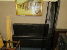 A brown padded leatherette double bed