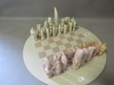 Stoneware chess set complete with circular board