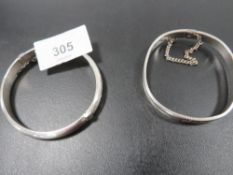 A hallmarked silver bangle with another unmarked example (2)