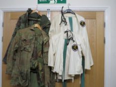 A selection of clothing to include one adults and one child's Tae Kwon-do suits two camouflage