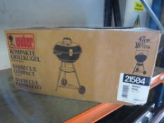 A boxed barbecue grill
