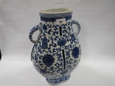 A modern Chinese blue/white twin handled vase with character mark to base (one handle broken and