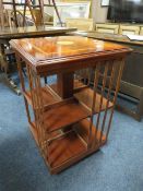 An reproduction inlaid revolving bookcase