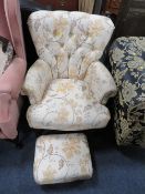 A floral button backed armchair with matching footstool