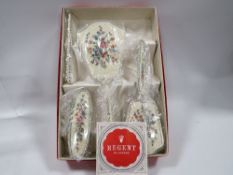 A vintage Regent of London dressing table set in original box