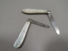 Two silver hallmarked mother of pearl fruit knives
