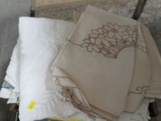 A tray containing embroidered/crochet work/drawn thread work, tablecloths, vintage hand sew quilt