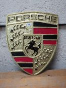 A large aluminum Porsche plaque**