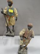 A pair of Austrian style cold painted spelter type figures of north African gentleman both A/F one