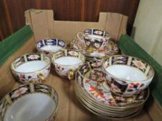 Five Royal Crown Derby Imari trio's together with another matched cup - with a repaired handle