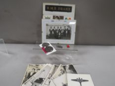 A quantity of military interest badges/photographs etc