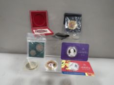 A bag of collectors coins and medals