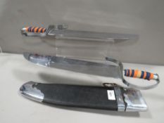 A ceremonial twin sword in case