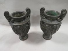A pair of Coalbrook style cast urns with Greco Roman frieze