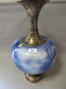 A large early 20th century Royal Doulton blue/white gilt transfer printed vase