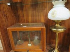 Cased weighing scales together with a brass lamp (2)