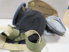 A collection of military and other hats to include an R.A.F example