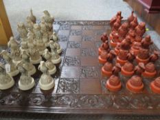 A hand carved bird chess set