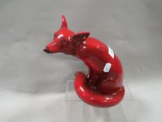 A Doulton style flambe fox A/F