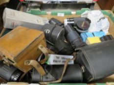 A box of mixed lenses and accessories