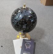 A night sky celestial globe with four dial weather station to base