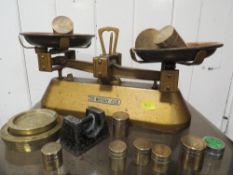 A set of money scales and weights