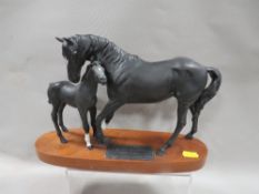 A Beswick figure of a horse on plinth - Black Beauty & Foal