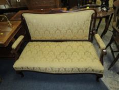 A small mahogany Edwardian upholstered settee