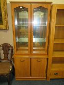 A modern glazed two door display unit