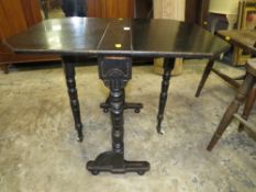 A small Edwardian ebonized aesthetic period sutherland table