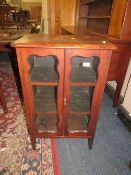 A small antique mahogany two door glazed cabinet W 57 cm