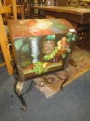A painted domed casket on wrought stand