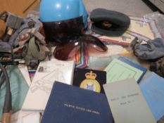 A tray of military and aviation collectables to include pilot helmet, fly log book circa 1990 etc