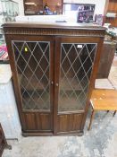A leaded glazed bookcase